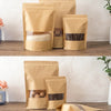 Three reusable kraft paper zipper bags filled with various dry goods like grains and tea leaves