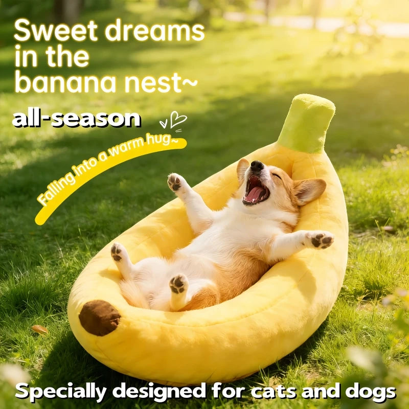 A golden yellow banana-shaped plush pet bed with a green accent is shown outdoors on green grass.