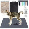 A dog is standing on a gray reusable washable pet training mat with a waterproof absorbent pad.