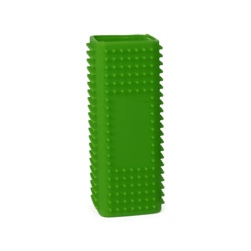 A bright green pet hair removal brush with silicone hollow rubber bristles.