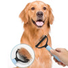 A hand holds a professional pet deshedding brush being used on the coat of an orange-colored dog.