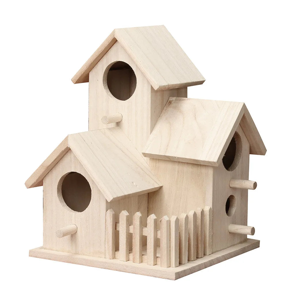 A light wood birdhouse with a pitched roof and decorative slats, designed for garden or patio use.