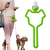 A green hands-free dog poop bag dispenser with a leash clip is shown next to a person and a dog.