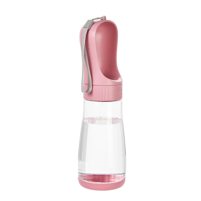 A pink 2-in-1 portable pet water and food dispenser with a clear bottle and a silicone straw.