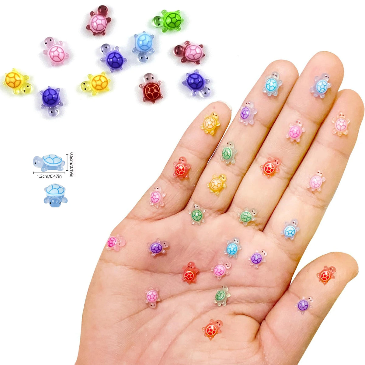 A hand displays various colorful luminous resin turtle ornaments in different sizes and colors.