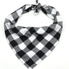 A black and white plaid cotton dog bandana tied around the neck.