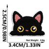 Black cat embroidered iron-on patch with yellow eyes and pink inner details