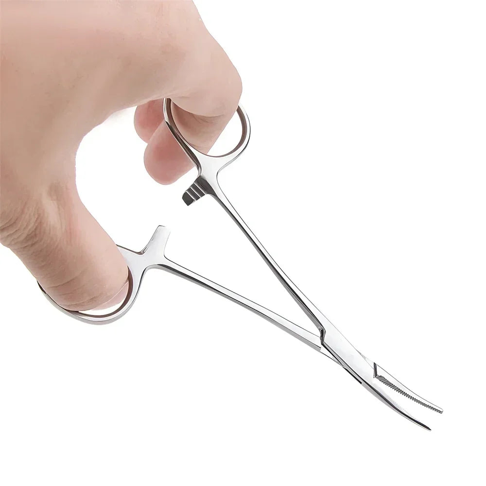 A hand holds a stainless steel pet ear hair tweezers with a curved tip.