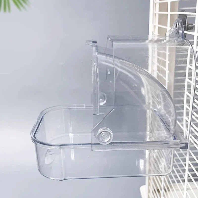 Clear plastic external bird bath designed to fit into a cage for parakeets