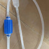 A clear plastic siphon pump and tubing assembly with a blue silicone adapter for aquarium gravel cleaning.