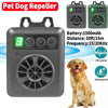 A gray ultrasonic pet dog repeller device with a circular grille and battery indicator, shown next to a dog.