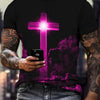 A man wearing a black t-shirt with a glowing pink cross design and dark clouds, holding a smartphone.