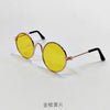 Gold-toned round sunglasses with yellow lenses and black frames.