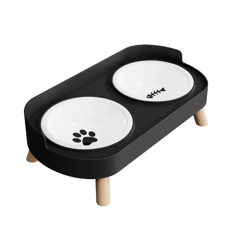 Black stainless steel double bowl for dogs and cats with two white bowls on a wooden stand