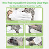 Disposable pet grooming gloves and wipes used to clean a cat's face, eyes, ears, claws, and buttocks.