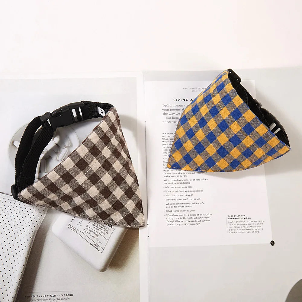 A brown and tan plaid bandana scarf for dogs and cats displayed on a white background.