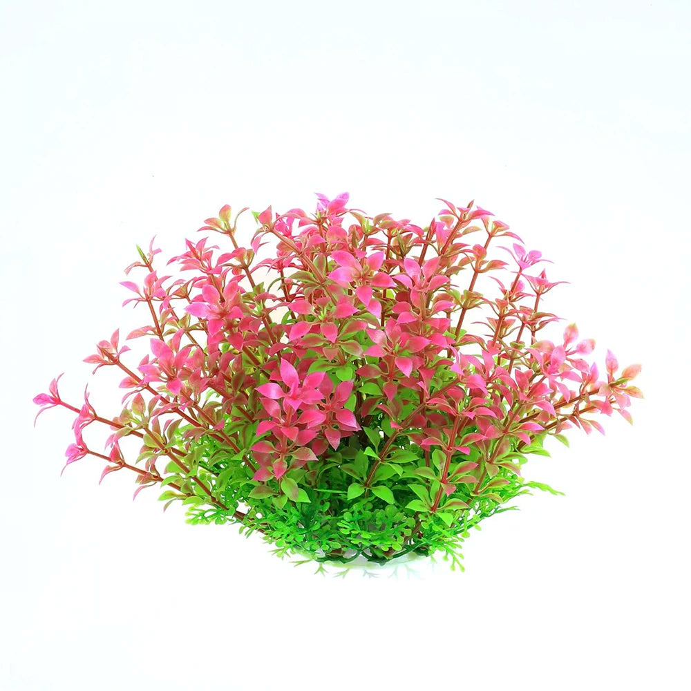 A cluster of vibrant pink and green artificial aquarium plants.