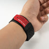 A black silicone sport band with a red label marked ULTRA SPORT METAL 304 is shown on a wrist.
