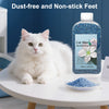 A white cat sits next to a bottle of cat litter deodorizing beads and a small bowl of blue beads.