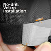 Close-up of a black velcro installation on a mesh pet gate barrier showing strong adhesive backing and dense hook surface.