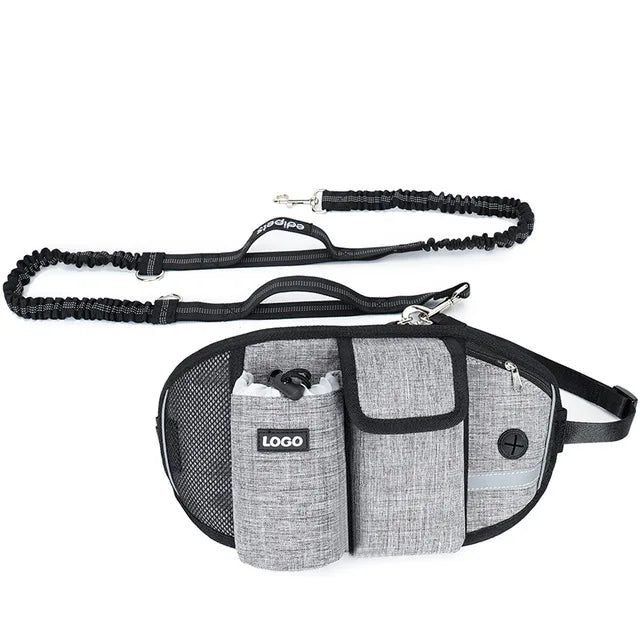 A gray hands-free dog walking belt with storage pockets and a bungee leash.