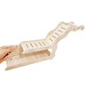 A hand holds a wooden hamster hideout cave with a peekaboo design, showing its layered structure.