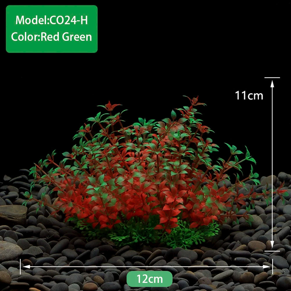 A dense cluster of red and green artificial aquarium plants planted in dark gravel.