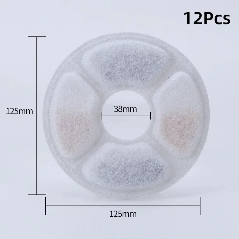 Twelve replacement activated carbon filters for a cat water fountain, circular and white.