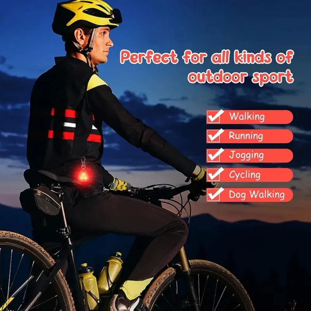 A person wearing a black and yellow cycling jersey is riding a bicycle outdoors with a waterproof LED pet collar light visibl
