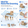 A blue pet grooming hammock is shown with a cat resting on it, demonstrating its use for home pet grooming.