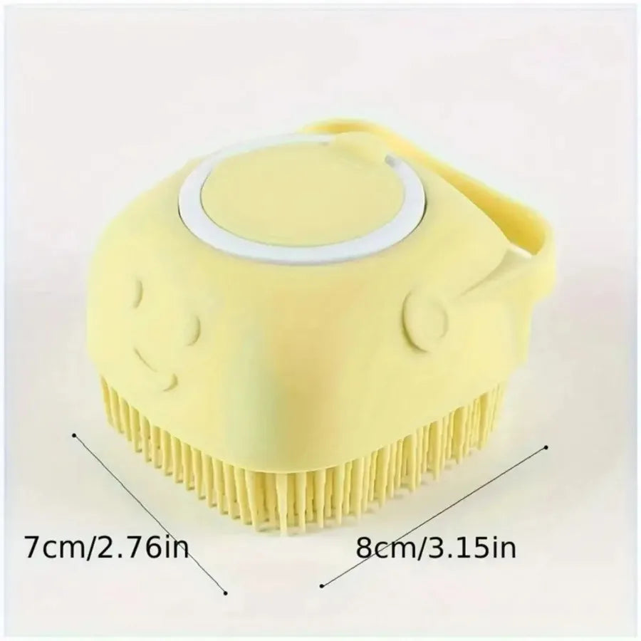 A yellow gentle dog bath brush with a shampoo dispenser shown from above.