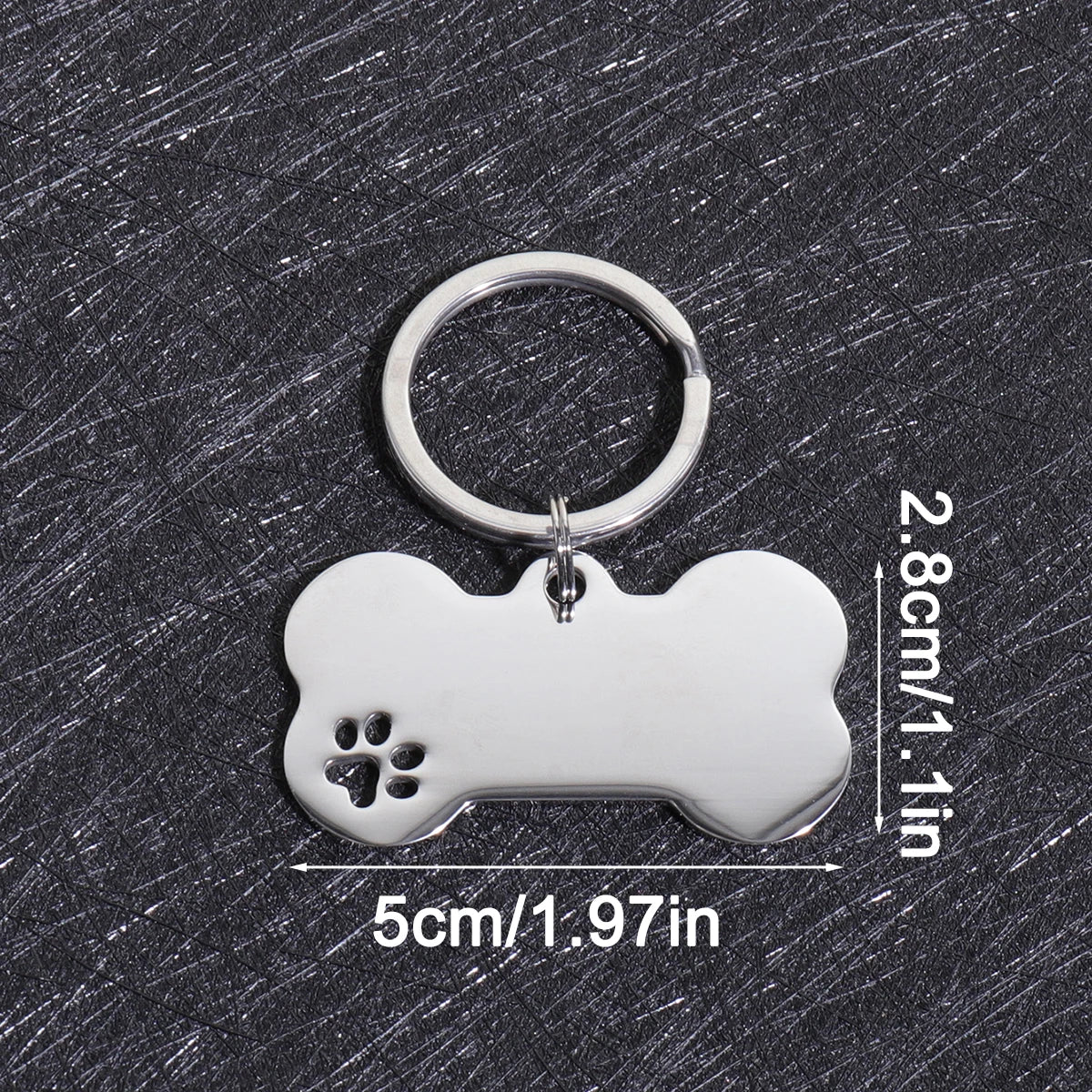 Silver bone-shaped dog ID tag with a circular keyring and dimensions listed.