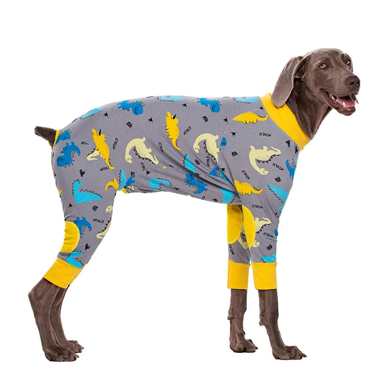 A dog wearing a long-sleeved, gray cotton pajama top with colorful cartoon animal prints.