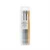 A clear plastic package containing a set of four toothbrushes and a travel case.