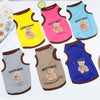 A collection of five colorful pet vests featuring cartoon bears with the text GOOD DAY!