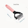 Small pink stainless steel pet grooming comb with a black handle and teeth