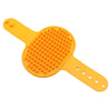 A bright yellow rubber pet grooming brush with a textured head and an adjustable handle.