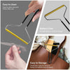 A hand demonstrates the easy to clean manual lint remover brush with a gold and black handle, showing its use for removing li