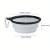 A white silicone dog travel bowl with a black rim and a metal clip.