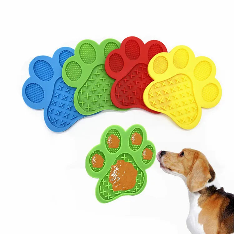 A set of silicone pet licking mats in various colors, including blue, green, red, and yellow, shown next to a dog's head.