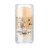 A clear glass tube of pet stick nose and paw balm for dogs and cats with a light beige product inside.