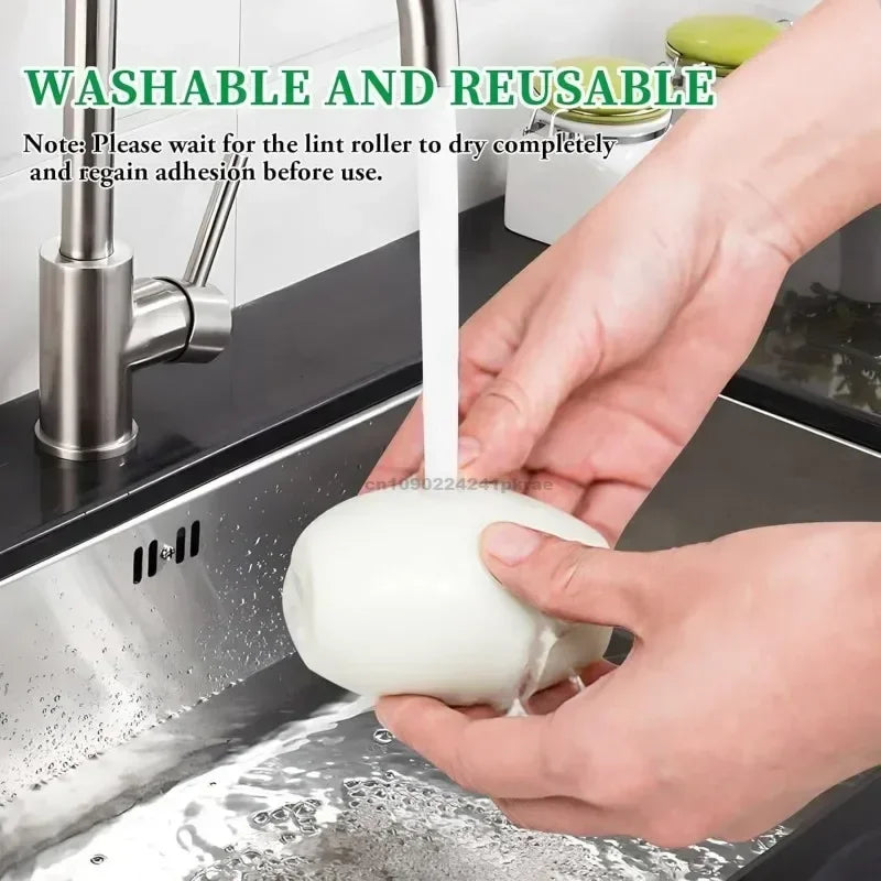 Hands are using a white lint roller to remove pet hair from a stainless steel sink.