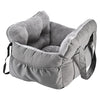 A gray durable pet car seat with a soft lining and safety straps.
