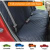 A dark gray waterproof dog car seat cover with side flaps installed in a red car interior.