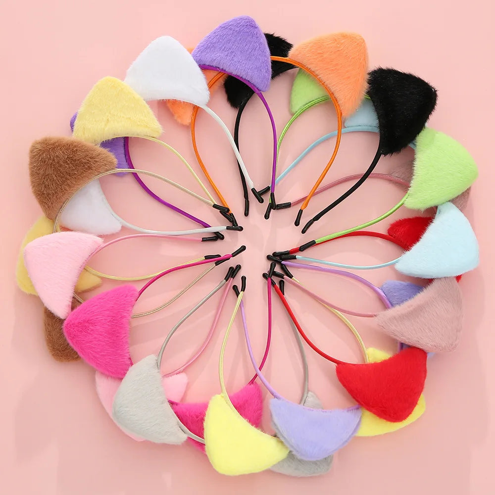 A colorful arrangement of plush cat ear headbands in various shades including pink, yellow, purple, and orange.