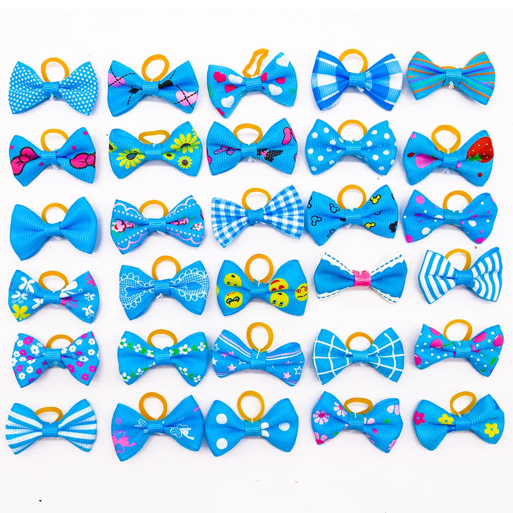 A collection of colorful pet hair bows in various patterns and colors attached with gentle rubber bands.