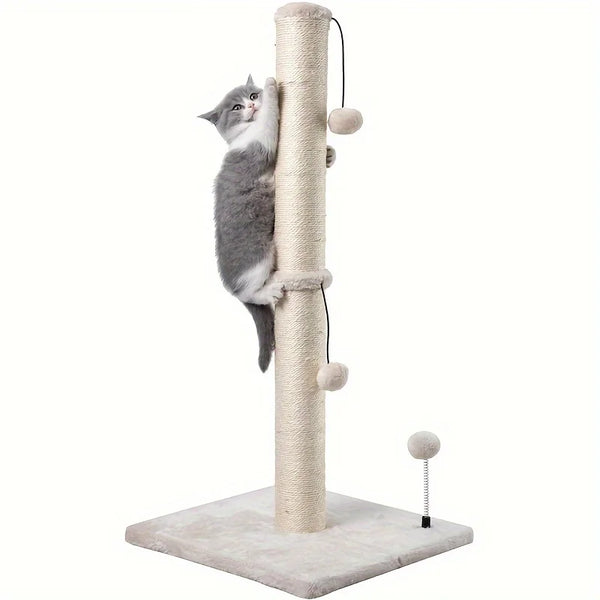 A gray cat is climbing a natural sisal scratching post tree with dangling balls.