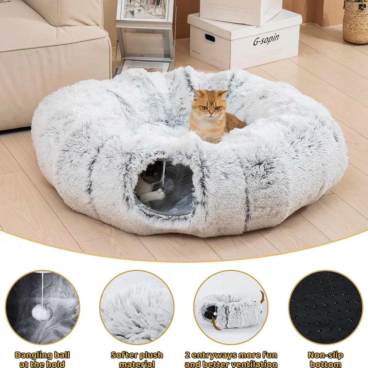 A round, fluffy white cat tunnel bed with a hole for hiding, shown next to a cat.