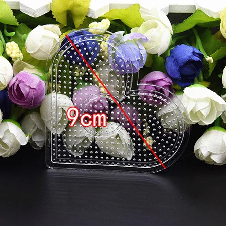 A precision hama beads tweezers kit is shown with various colored beads and flowers in a natural setting.
