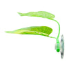 A green leaf is attached to a suction cup, designed as a hammock for a betta fish.